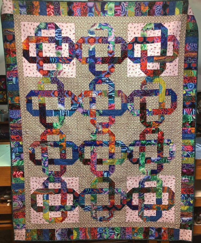 Knots In The Garden Bat Quilt By Emily Davis. 62 by 78 inches.
